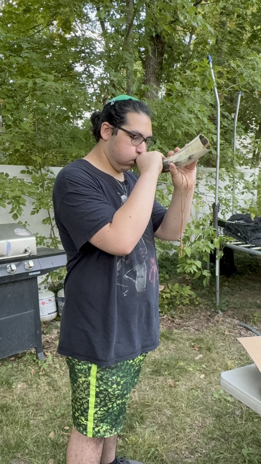 A student blowing the shofar